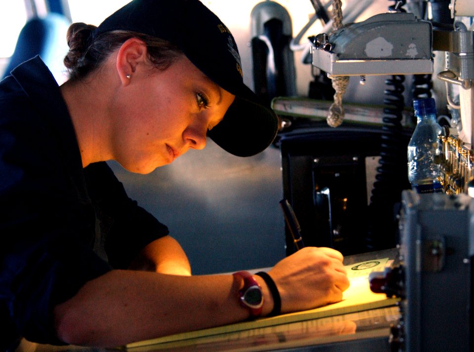 US Navy 060312-N-4776G-141 Boatswain's Mate Seamen Andrea Hackett, writes in the deck log on the bridge aboard the Nimitz-class aircraft carrier USS Ronald Reagan (CVN 76)