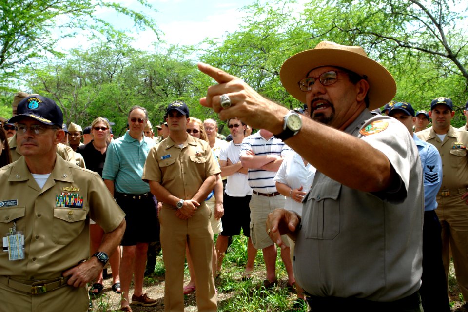 US Navy 060316-N-9643K-001 National Park Service Ranger Daniel Martinez addresses a group of Sailors from the Pearl Harbor Surface Navy Association (SNA) at the site of the USS Arizona relics