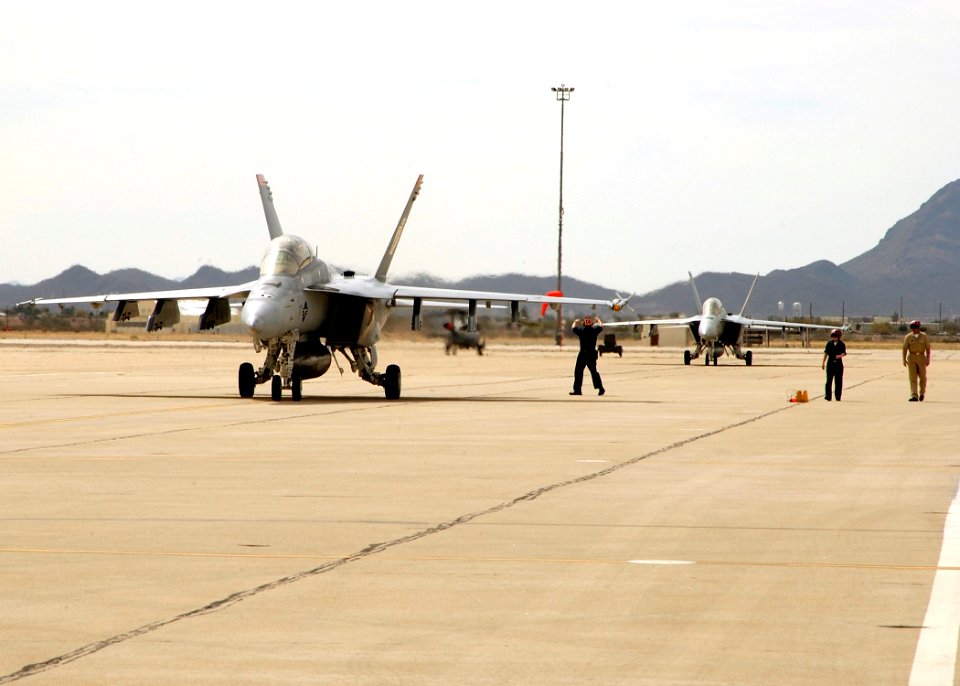 US Navy 060403-F-3177P-036 F-A-18F Super Hornets assigned to the Black Aces of Strike Fighter Squadron Four One (VFA-41) taxi on the flight line after the completion of a training exercise