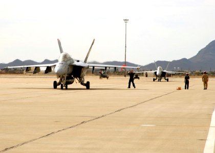 US Navy 060403-F-3177P-036 F-A-18F Super Hornets assigned to the Black Aces of Strike Fighter Squadron Four One (VFA-41) taxi on the flight line after the completion of a training exercise