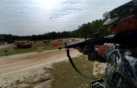 US Navy 060405-N-4097B-027 An Army drill sergeant shoots at Sailors on a simulated battlefield during the Navy's Individual Augmentee Combat Training course at Fort Jackson, S.C