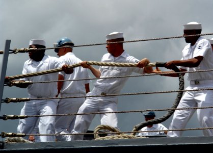 US Navy 060505-N-9643K-025 Sailors heave around on a mooring line as guided-missile frigate USS Crommelin (FFG 37) departs Pearl Harbor