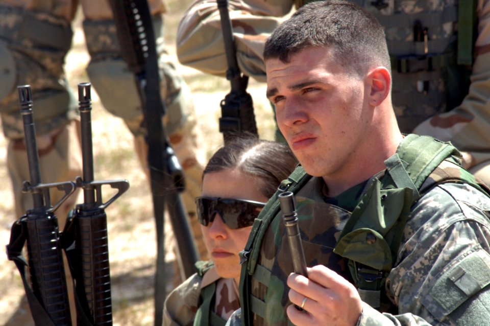 US Navy 060405-N-4097B-025 Sailors listen closely as Army drill instructors provide combat survival skills training as part of the Navy's Individual Augmentee Combat Training course at Fort Jackson, S.C