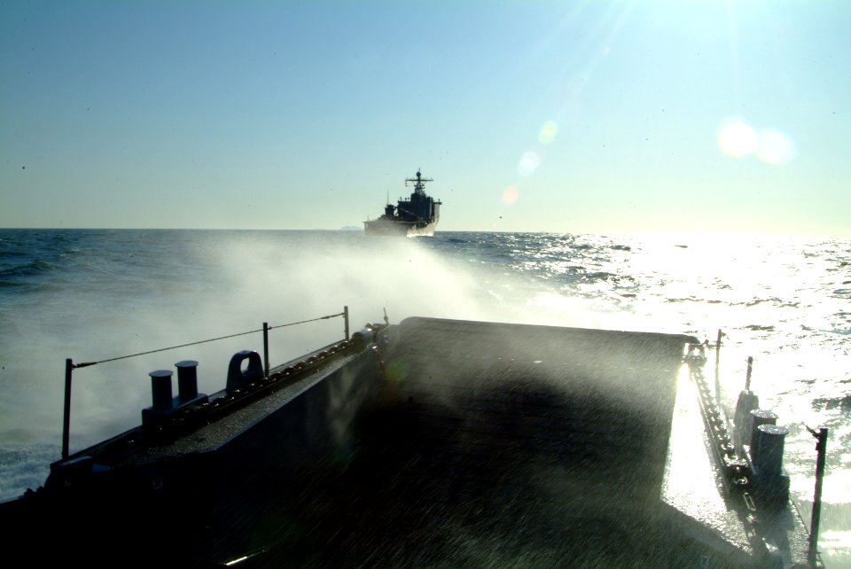 US Navy 060330-N-4772B-141 A Landing Craft Utility (LCU) assigned to the Assault Craft Unit One (ACU-1) makes its way to the amphibious dock landing ship USS Harpers Ferry (LSD 49), during a combined amphibious landing exercise