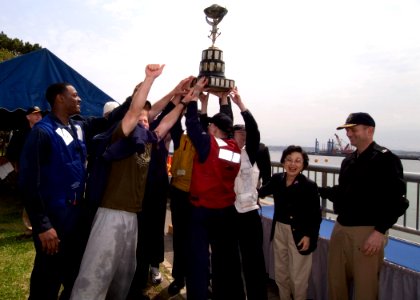 US Navy 060414-N-2385R-012 USS John S. McCain's Rigid Hull Inflatable Boat (RHIB) crew holds the coveted George I. Purdy Trophy after winning the annual RHIB Race