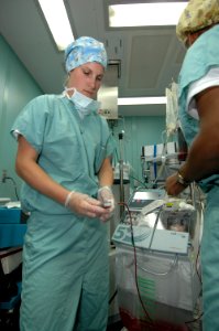 US Navy 060505-N-2832L-075 Hospital Corpsman Megan Beach, an anesthesiologist technician, practices checking the quality of the blood