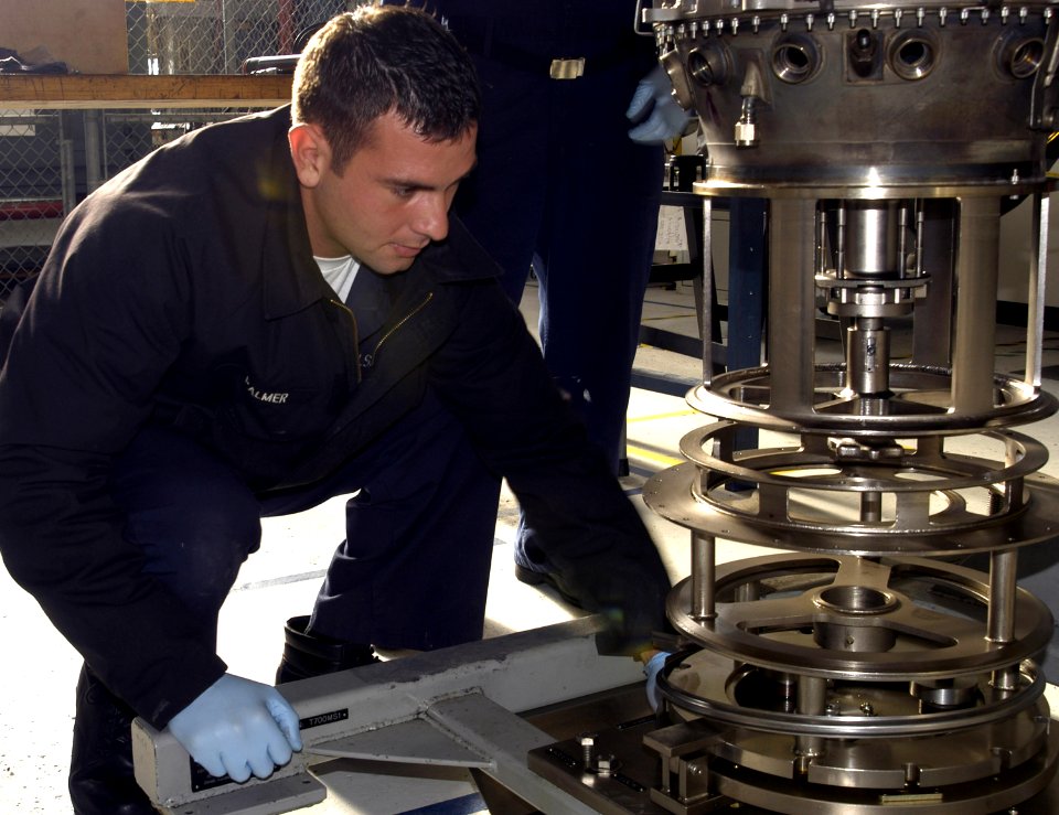 US Navy 060407-N-1648R-007 Aviation Machinist's Mate Airman Paolo Palmer, assigned to Aviation Intermediate Maintenance Department (AIMD) (NAS) North Island, assembles a T700 engine