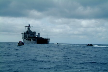 US Navy 060322-N-4772B-101 Amphibious Assault Vehicles (AAV) assigned to the 31st Marine Expeditionary Unit (MEU) prepare to enter the well deck of the amphibious dock landing ship USS Harpers Ferry (LSD 49)