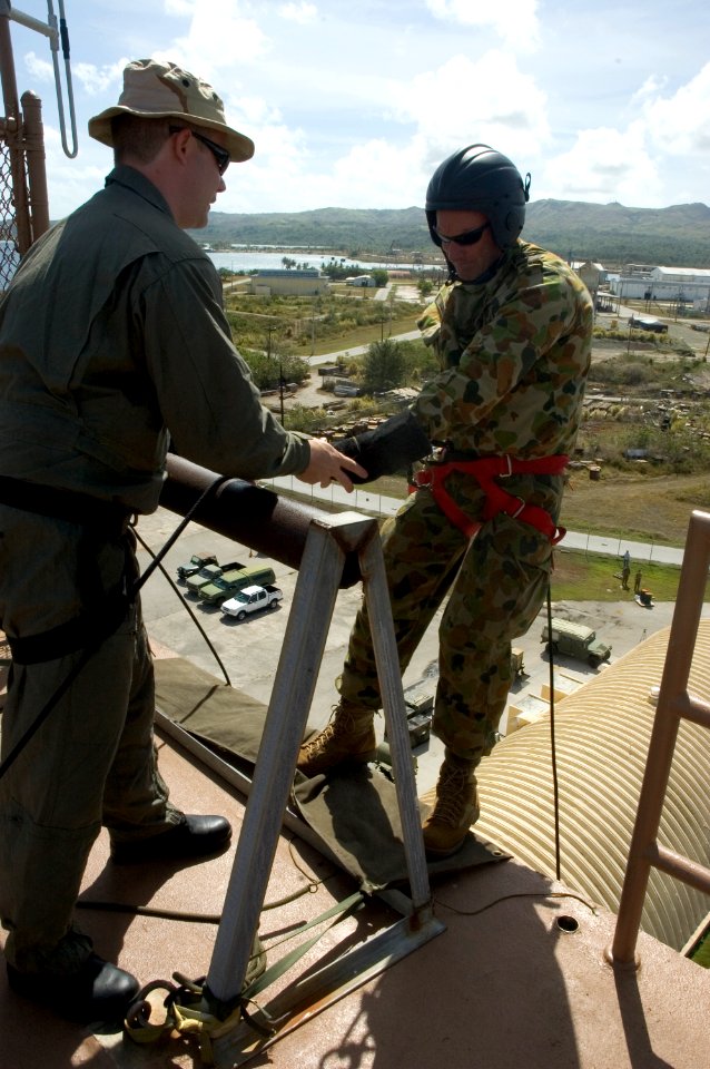 US Navy 060419-N-9167V-412 Chief Petty Officer Jeremy Logan assigned to Explosive Ordnance Disposal Mobile Unit Five (EODMU-5) gives some last-minute advice to Lt. Cmdr. Michael Maley from the Royal Australian Navy