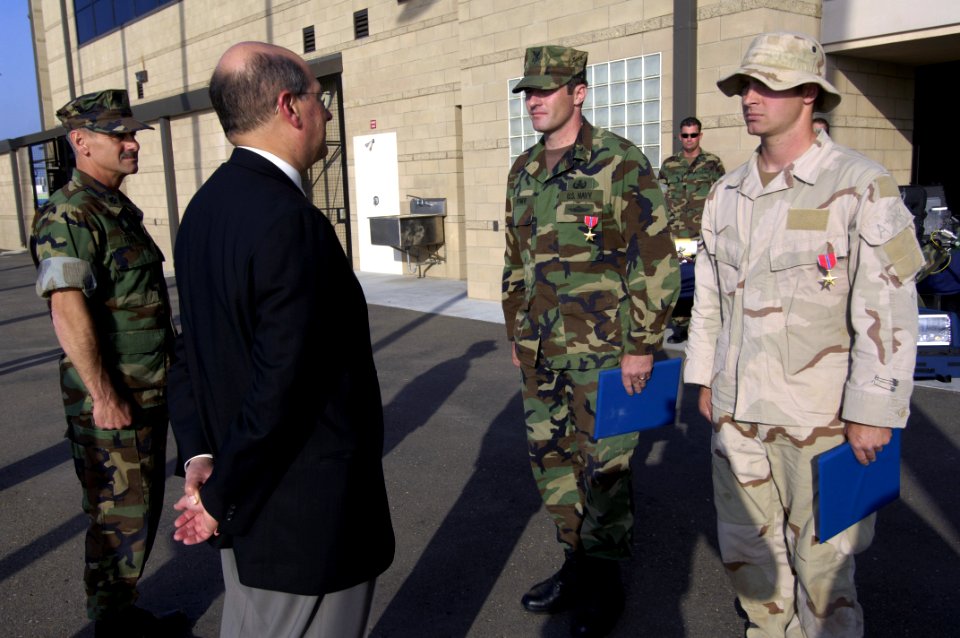 US Navy 060509-N-2568S-314 SECNAV presents the Bronze Star medal to AO1 Bryan Bymer and ET1 Wayne McElmoyl for their actions in Iraq
