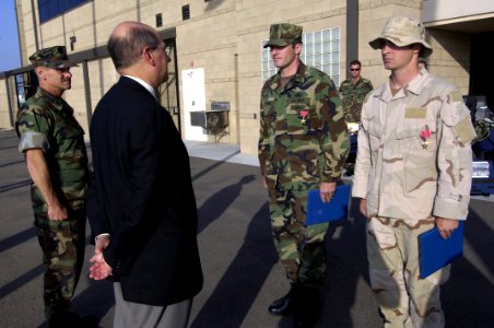 US Navy 060509-N-2568S-314 SECNAV presents the Bronze Star medal to AO1 Bryan Bymer and ET1 Wayne McElmoyl for their actions in Iraq
