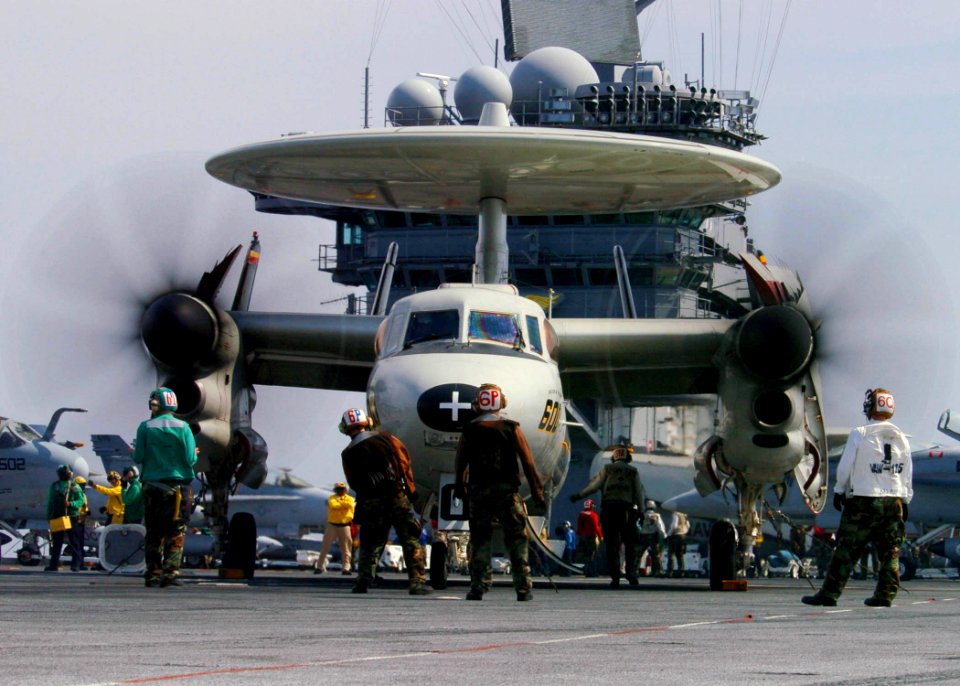 US Navy 060415-N-7359L-002 Sailors prepare an E-2C Hawkeye assigned to the Tigertails of Carrier Airborne Early Warning Squadron One Two Five (VAW-125), for launch