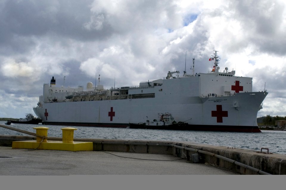 US Navy 060515-N-4658L-054 The Military Sealift Command (MSC) hospital ship USNS Mercy (T-AH 19), navigates through a rainy morning entering Apra Harbor, Guam
