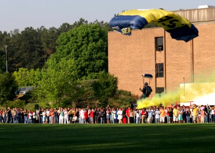 US Navy 060425-N-7517M-009 A U.S. Navy Parachute Demonstration Team member assigned to the Leap Frogs, descends at Dunwoody High School in support of Navy Week