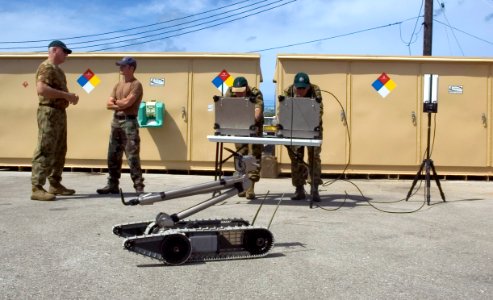 US Navy 060419-N-9167V-424 U.S. and Royal Australia military personnel demonstrate a Pack Robot at the Explosive Ordnance Disposal Mobile Unit Five (EODMU-5) compound on board Naval Base Guam