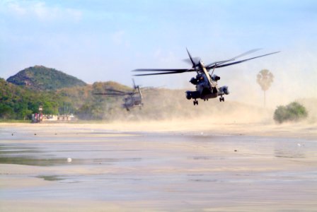 US Navy 060515-N-4772B-090 A pair of CH-53E Super Stallion helicopters land on the beach in Thailand to offload elements of the 31st Marine Expeditionary Unit (MEU)