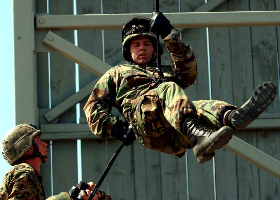 US Navy 060420-F-0692M-188 U.S. Navy Photographer's Mate 1st Class Richard Bruson assigned to Combat Camera Group Pacific, rappels down a rope