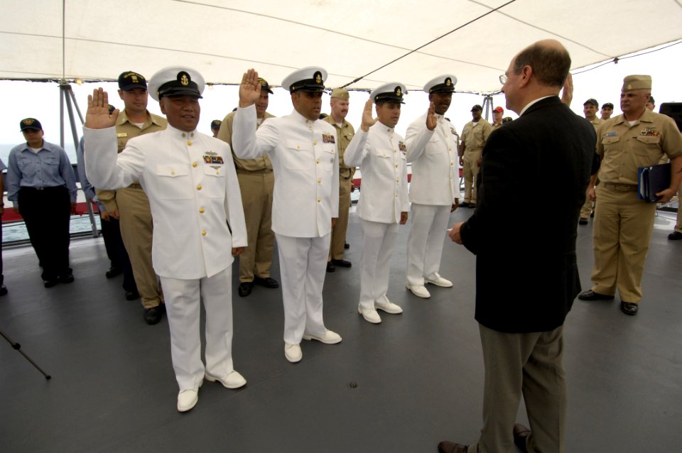 US Navy 060419-N-2568S-099 Secretary of the Navy (SECNAV), the Honorable Dr. Donald C. Winter conducts a reenlistment for chief petty officers aboard the submarine-tender USS Emory S. Land (AS 39)