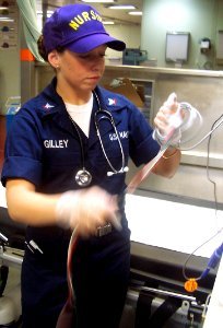 US Navy 060501-N-0780W-004 Hospital Corpsman 3rd Class Mandy Gilley, a casualty receiving corpsman aboard the Military Sealift Command (MSC) hospital ship USNS Comfort (T-AH 20) reorganizes equipment after the shipUs mass casua photo