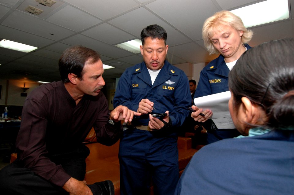 US Navy 060518-N-2832L-013 Senior training specialist with Multi-Services Group International (MSGI), Michael Bedwell, trains Sailors to use Battlefield Medical Information Systems Telemedicine (BMIST) equipped Personal Digital
