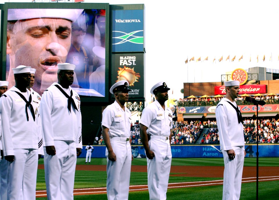 US Navy 060428-N-7517M-016 Musician 3rd Class Phil Stacey assigned to Navy Band Southeast sings the National Anthem prior to an Atlanta Braves game at Turner Field