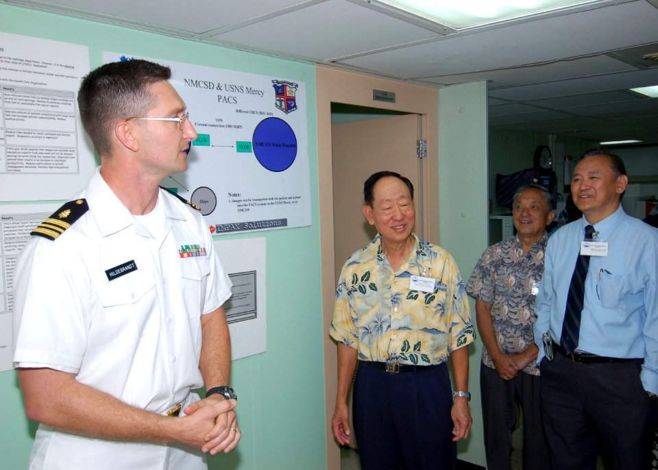 US Navy 060502-N-3532C-079 Lt. Cmdr. Kurt Hildebrandt, M.D. discusses radiology with Aloha Medical Mission (AMM) members while they tour the Military Sealift Command (MSC) hospital ship USNS Mercy (T-AH 19)