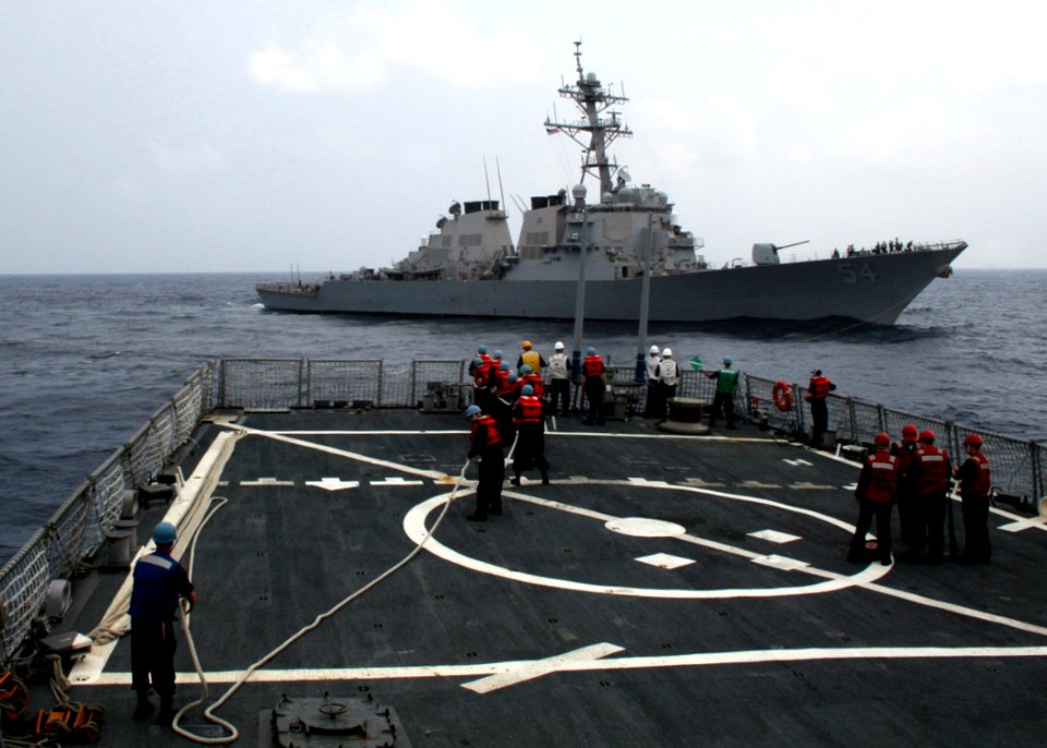 US Navy 060504-N-4953E-008 Boatswain's mates heave lines as the guided-missile destroyer USS Stethem (DDG 63) prepares to tow the guided-missile destroyer USS Curtis Wilbur (DDG 54) during a towing exercise (TOWEX)