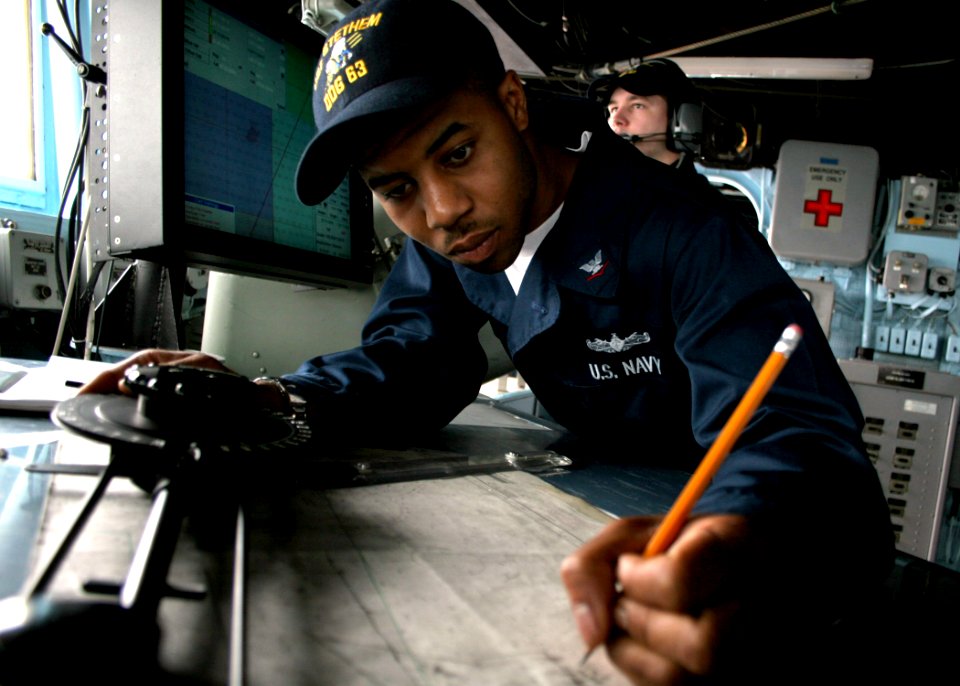 US Navy 060504-N-4953E-029 Quartermaster 3rd Class Carrin Johnson assigned to the guided-missile destroyer USS Stethem (DDG 63), plots the ship's course. Stethem is currently participating in Multi-Sail 2006