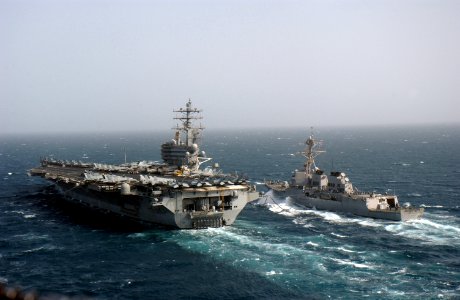 US Navy 060505-N-0610T-208 The guided missile destroyer USS McCampbell (DDG 85) comes alongside the Nimitz-class aircraft carrier USS Ronald Reagan (CVN 76) for a routine fueling at sea (FAS)