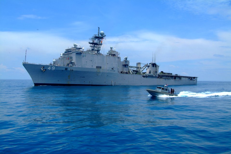 US Navy 060517-N-4772B-046 A Rigid Hull Inflatable Boat speeds to escort Amphibious Assault Vehicles (AAV) assigned to 31st Marine Expeditionary Unit (MEU) towards USS Harpers Ferry (LSD 49)