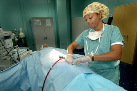 US Navy 060505-N-2832L-056 Lt. Angela Banks draws blood from a mannequin during training for antilogous blood transfusion with a cell saver in one of the 12 operating rooms aboard Military Sealift Command (MSC) hospital ship U