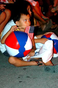 US Navy 060521-N-2832L-295 A Philippine boy watches Musicians from the U.S. Navy Showband, deployed aboard the Military Sealift Command (MSC) hospital ship USNS Mercy (T-AH 19), as they perform an open air free show at Manila's
