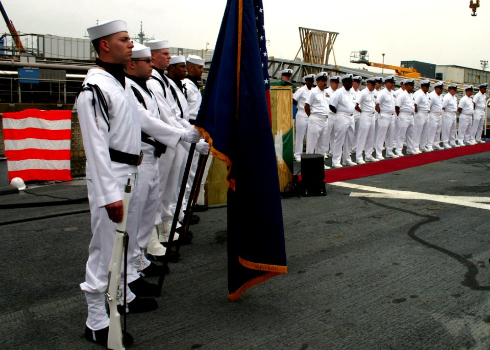 US Navy 060602-N-4953E-002 Members of guided-missile destroyer USS Stethem (DDG 63) Flag Detail stands at attention along with Chief Petty Officers during a retirement ceremony in honor of Chief Gas Turbine Systems Technician T