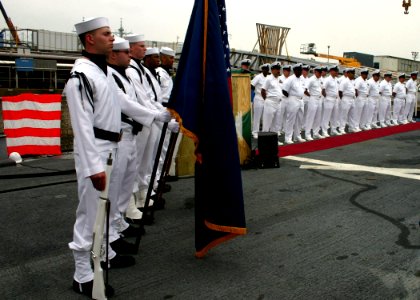 US Navy 060602-N-4953E-002 Members of guided-missile destroyer USS Stethem (DDG 63) Flag Detail stands at attention along with Chief Petty Officers during a retirement ceremony in honor of Chief Gas Turbine Systems Technician T
