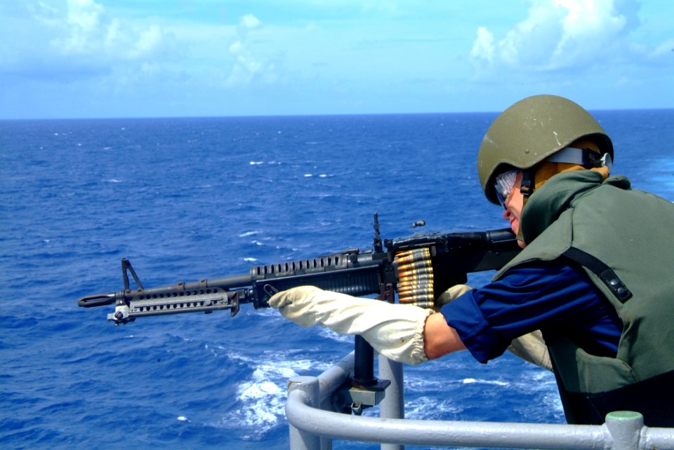 US Navy 060605-N-4772B-010 Midshipman 2nd Class John D. Jones gets small arms training on the bridgewing of the amphibious dock landing ship USS Harpers Ferry (LSD 49)