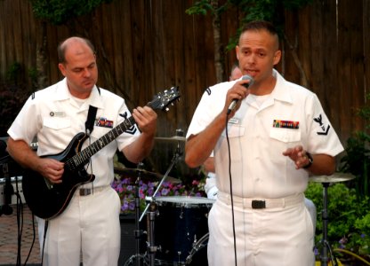 US Navy 060522-N-2908O-001 Navy Band Mid-South Lead singer Musician 3rd Class Spencer Haasenritter and base guitarist Musician 2nd Class Austin Alley perform live on-air for the local CBS affiliate KTHV-TV Morning show