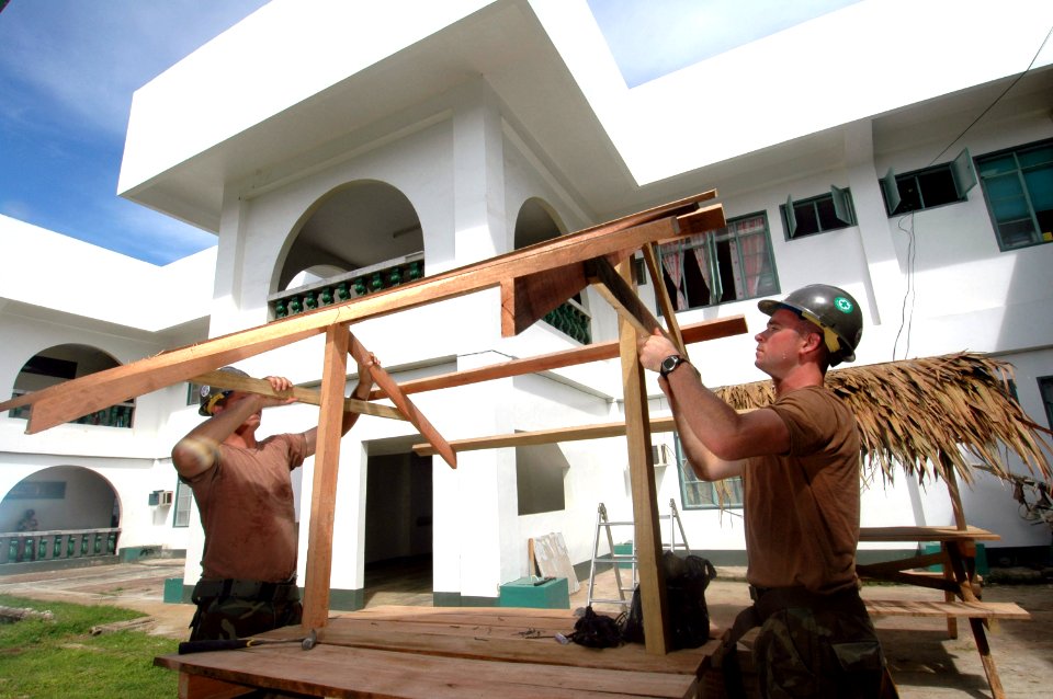 US Navy 060607-N-3532C-024 Seabees assigned to Naval Mobile Construction Battalion Four Zero (NMCB-40), put together a table at Sulu Provincial Hospital