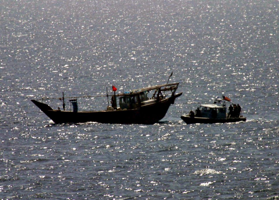 US Navy 060507-N-0000X-100 Sailors assigned to dock landing ship USS Germantown (LSD 42) prepare to board an Iranian dhow after the vessel called for assistance for an injured crew member