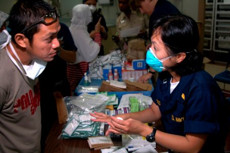 US Navy 060608-N-3532C-006 Navy Lt. Alice Moss, a pharmacist with the Medical Treatment Facility aboard the U.S. Military Sealift Command (MSC) Hospital ship USNS Mercy (T-AH 19) photo