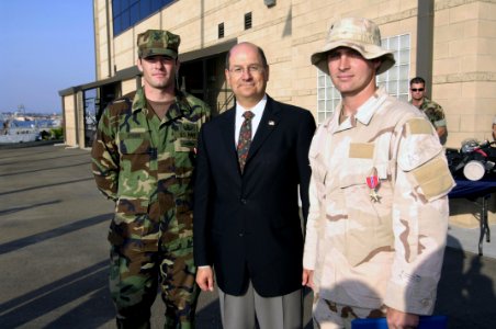 US Navy 060509-N-2568S-316 SECNAV presents the Bronze Star medal to AO1 Bryan Bymer and ET1 Wayne McElmoyl for their actions in Iraq