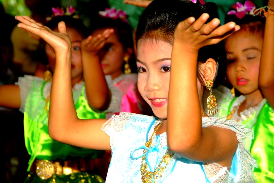 US Navy 060525-N-4772B-145 Local school children perform a traditional Thai dance for Sailors and Marines during a Community Relations (COMREL) project