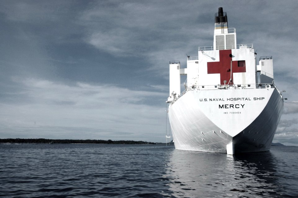US Navy 060611-N-2832L-056 U.S. Military Sealift Command (MSC) Hospital Ship USNS Mercy (T-AH 19) anchors off the city coast, while the ship and her crew begin their 1st day of humanitarian aid