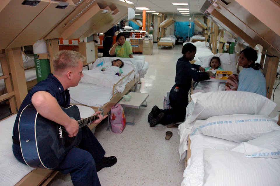 US Navy 060614-N-1577S-014 U.S. Navy Aviation Electronics Technician 3rd Class Eric Bloom of Minneapolis, plays the guitar