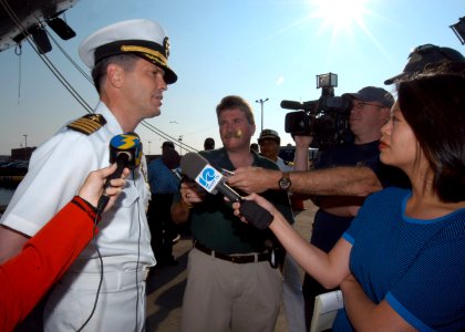 US Navy 060606-N-6214F-031 USS Iwo Jima (LHD 7) Commanding Officer, Capt. Michael A. Walley, answers questions from local media prior to the ship departing Naval Station Norfolk