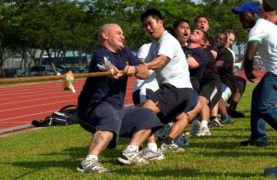 US Navy 060612-N-9851B-002 Republic of Singapore Navy Sailors pull alongside U.S. Navy teammates assigned to the dock landing ship USS Tortuga (LSD 46) and guided-missile frigate USS Crommelin (FFG 37) during a sports day tug-o