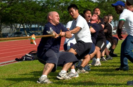 US Navy 060612-N-9851B-002 Republic of Singapore Navy Sailors pull alongside U.S. Navy teammates assigned to the dock landing ship USS Tortuga (LSD 46) and guided-missile frigate USS Crommelin (FFG 37) during a sports day tug-o