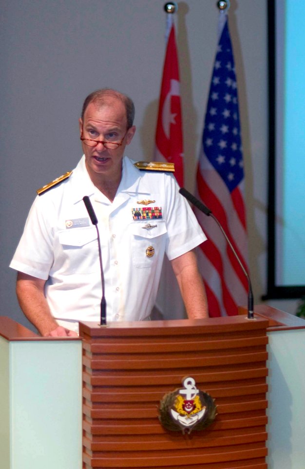US Navy 060530-N-9851B-003 Commander Logistics Group Western Pacific Rear Adm. William R. Burke speaks to an audience of nearly 250 U.S. Navy and Republic of Singapore Navy Sailors in the Changi Navy Base auditorium