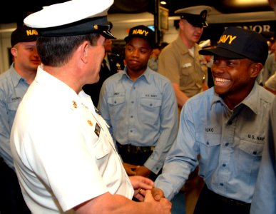 US Navy 060519-N-0962S-062 Master Chief Petty Officer of the Navy (MCPON) Terry Scott congratulates some of the Navy's newest Sailors as they receive their Navy ballcaps after successful completion of Battle Stations on board R