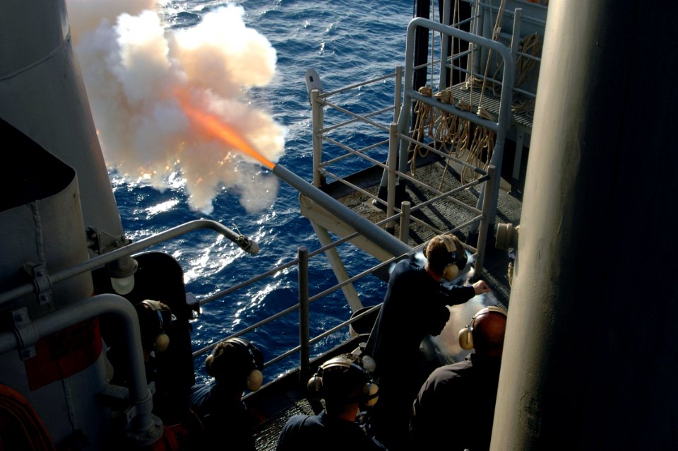 US Navy 060520-N-1512O-033 Gunner's Mates aboard the amphibious assault ship USS Bataan (LHD 5) fire the .40mm saluting battery as part of their initial qualifications, while underway