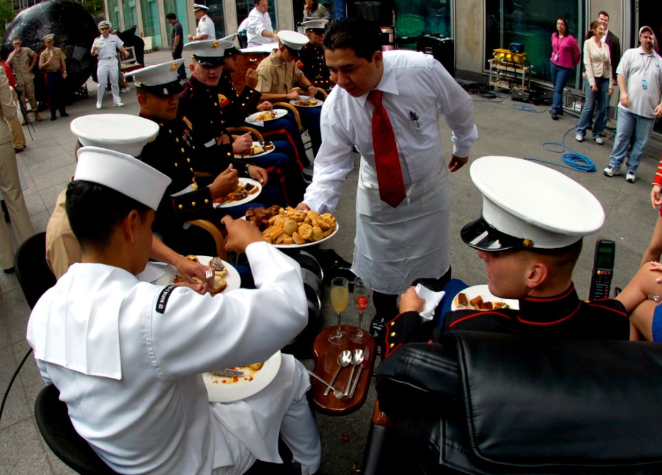 US Navy 060526-N-7676W-143 Amphibious assault ship USS Kearsarge (LHD 3) Sailors and Marines are served breakfast, while relaxing in massage chairs outside Fox News studios